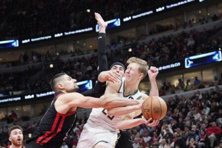 Mar 1, 2024; Chicago, Illinois, USA; Chicago Bulls center Nikola Vucevic (9) flagrantly fouls Milwaukee Bucks guard AJ Green (20) during the second half. Vucevic was kicked out of the game at United Center. Mandatory Credit: David Banks-USA TODAY Sports