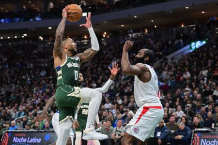 Mar 4, 2024; Milwaukee, Wisconsin, USA; Milwaukee Bucks guard Damian Lillard (0) drives for the basket against Los Angeles Clippers guard James Harden (1) in the third quarter at Fiserv Forum. Mandatory Credit: Benny Sieu-USA TODAY Sports