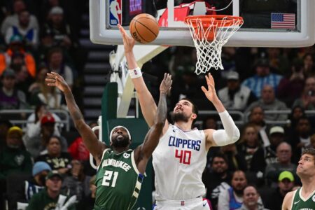 Mar 4, 2024; Milwaukee, Wisconsin, USA; Milwaukee Bucks guard Patrick Beverley (21) and Los Angeles Clippers center Ivica Zubac (40) reach for a rebound in the third quarter at Fiserv Forum. Mandatory Credit: Benny Sieu-USA TODAY Sports
