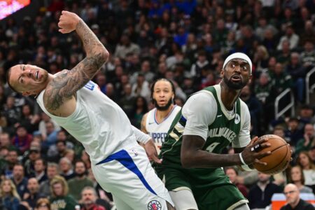 Mar 4, 2024; Milwaukee, Wisconsin, USA; Milwaukee Bucks forward Bobby Portis (9) takes a shot against Los Angeles Clippers center Daniel Theis (10) in the third quarter at Fiserv Forum. Mandatory Credit: Benny Sieu-USA TODAY Sports