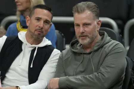 Mar 6, 2024; Milwaukee, Wisconsin, USA; Green Bay Packers head coach Matt LaFleur and Chicago Bears head coach Matt Eberflus talk while sitting courtside prior to the game between the Connecticut Huskies and Marquette Golden Eagles at Fiserv Forum. Mandatory Credit: Jeff Hanisch-USA TODAY Sports