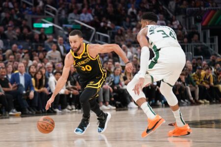 Mar 6, 2024; San Francisco, California, USA; Golden State Warriors guard Stephen Curry (30) dribbles past Milwaukee Bucks forward Giannis Antetokounmpo (34) in the third quarter at the Chase Center. Mandatory Credit: Cary Edmondson-USA TODAY Sports