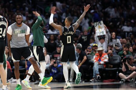 Mar 10, 2024; Los Angeles, California, USA; Milwaukee Bucks guard Damian Lillard (0) celebrates with teammates after making a three point basket in the fourth quarter against the Los Angeles Clippers at Crypto.com Arena. Mandatory Credit: Kiyoshi Mio-USA TODAY Sports