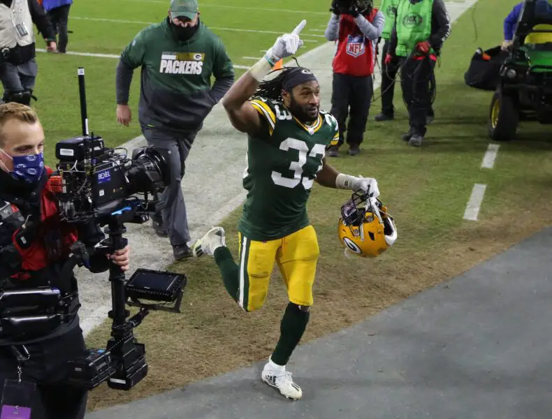 Green Bay Packers running back Aaron Jones (33) acknowledges the fans after the 32-18 win over the Los Angeles Rams during the NFC divisional playoff game Saturday, Jan. 16, 2021, at Lambeau Field in Green Bay, Wis. © Mike De Sisti / Milwaukee Journal Sentinel / USA TODAY NETWORK