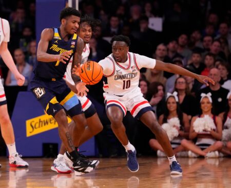 Mar 16, 2024; New York City, NY, USA; Connecticut Huskies guard Hassan Diarra (10) steals the ball from Marquette Golden Eagles guard Kam Jones (1) during the first half at Madison Square Garden. Mandatory Credit: Robert Deutsch-USA TODAY Sports