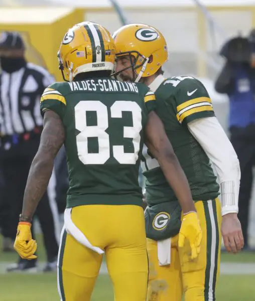 Green Bay Packers wide receiver Marquez Valdes-Scantling (83) celebrates scoring a touchdown with quarterback Aaron Rodgers (12) during the NFC championship game Sunday, January 24, 2021, at Lambeau Field in Green Bay, Wis. © Dan Powers via Imagn Content Services, LLC