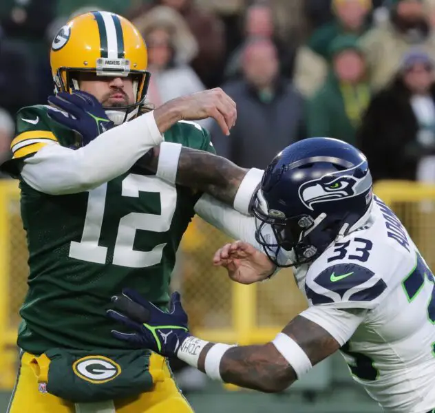 Green Bay Packers quarterback Aaron Rodgers (12) is pressured by Seattle Seahawks safety Jamal Adams (33) during the second quarter of their game Sunday, November 14, 2021 at Lambeau Field in Green Bay, Wis. The Green Bay Packers beat the Seattle Seahawks 17-0. © MARK HOFFMAN/MILWAUKEE JOURNAL SENTINEL / USA TODAY NETWORK