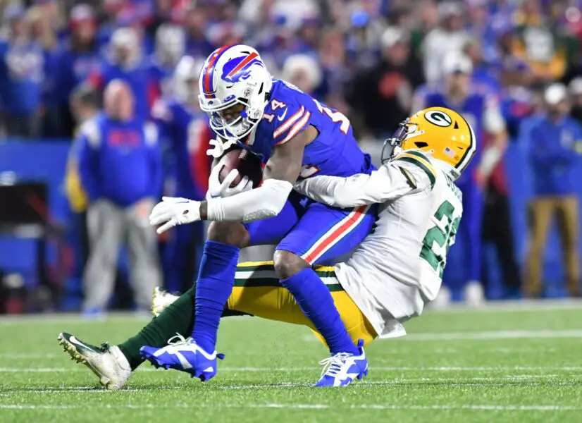 Oct 30, 2022; Orchard Park, New York, USA; Buffalo Bills wide receiver Stefon Diggs (14) is tackled by Green Bay Packers cornerback Rasul Douglas (29) after a catch in the third quarter at Highmark Stadium. Mandatory Credit: Mark Konezny-USA TODAY Sports