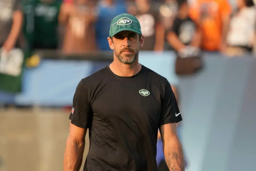 Aug 3, 2023; Canton, Ohio, USA; New York Jets quarterback Aaron Rodgers (8) watches from the sidelines during the first half against the Cleveland Browns at Tom Benson Hall of Fame Stadium. Mandatory Credit: Kirby Lee-USA TODAY Sports (Green Bay Packers)