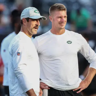 Aug 19, 2023; East Rutherford, New Jersey, USA; New York Jets quarterback Aaron Rodgers (8) speaks with New York Jets quarterback Tim Boyle (7) during warmups for the Jets game against the Tampa Bay Buccaneers at MetLife Stadium. Mandatory Credit: Ed Mulholland-USA TODAY Sports
