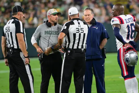 Aug 19, 2023; Green Bay, Wisconsin, USA; Green Bay Packers head coach Matt LaFleur and New England Patriots head coach Bill Bilicheck confer with officials before deciding to end the game after a serious injury to New England Patriots defensive back Isaiah Bolden (not pictured) in the fourth quarter at Lambeau Field. Mandatory Credit: Benny Sieu-USA TODAY Sports
