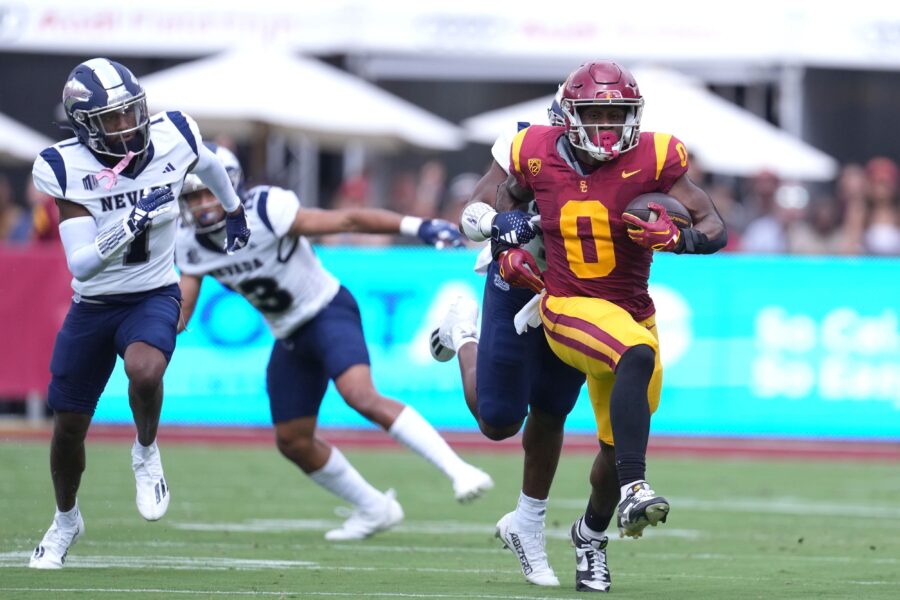 Sep 2, 2023; Los Angeles, California, USA; Southern California Trojans running back MarShawn Lloyd (0) carries the ball against Nevada Wolf Pack linebacker Davion Blackwell (9) in the first half at United Airlines Field at Los Angeles Memorial Coliseum. Mandatory Credit: Kirby Lee-USA TODAY Sports (Green Bay Packers)