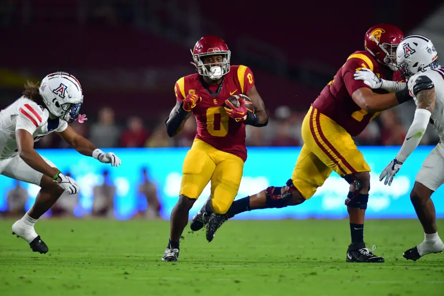 Oct 7, 2023; Los Angeles, California, USA; Southern California Trojans running back MarShawn Lloyd (0) runs the ball against the Arizona Wildcats during the first half at Los Angeles Memorial Coliseum. Mandatory Credit: Gary A. Vasquez-USA TODAY Sports
