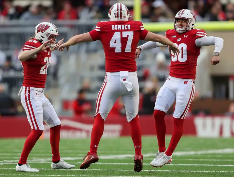 Wisconsin punter Gavin Meyers (28), long snapper Peter Bowden (47) and place kicker Nathanial Vakos (90) celebrate after Vakos makes a field goal against Iowa on Saturday, October 14, 2023, at Camp Randall Stadium in Madison, Wis. Iowa won the game, 12-6. © Tork Mason / USA TODAY NETWORK (Green Bay Packers)