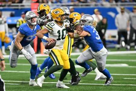 Nov 23, 2023; Detroit, Michigan, USA; Green Bay Packers quarterback Jordan Love (10) looks to throw a pass as Detroit Lions defensive end Aidan Hutchinson (97) (left) and linebacker Alex Anzalone (34) collapse the pocket in the fourth quarter at Ford Field. Mandatory Credit: Lon Horwedel-USA TODAY Sports