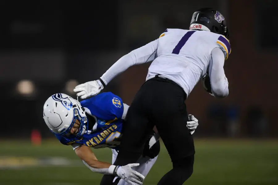 SDSU's cornerback Myles Taylor (20) tackles UAlbany's wide receiver Julian Hicks (1) on Friday, Dec. 15, 2023 at Dana J. Dykhouse in Brookings. © Samantha Laurey / Argus Leader / USA TODAY NETWORK