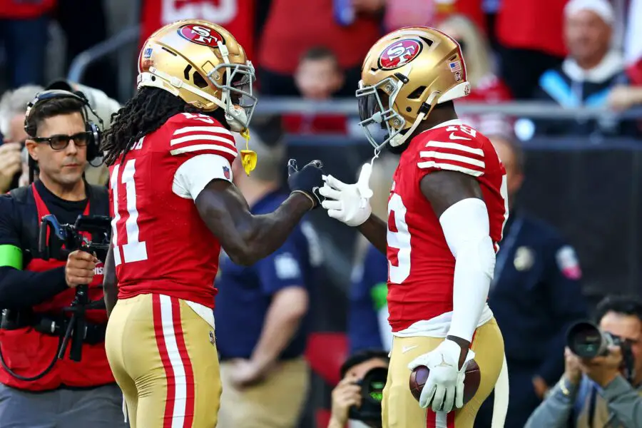 Dec 17, 2023; Glendale, Arizona, USA; San Francisco 49ers wide receiver Deebo Samuel (19) celebrates with wide receiver Brandon Aiyuk (11) after scoring a touchdown during the first quarter against the Arizona Cardinals at State Farm Stadium. Mandatory Credit: Mark J. Rebilas-USA TODAY Sports (Green Bay Packers)