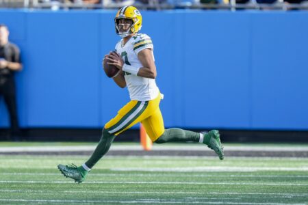 Dec 24, 2023; Charlotte, North Carolina, USA; Green Bay Packers quarterback Jordan Love (10) looks for a receiver against the Carolina Panthers during the second quarter at Bank of America Stadium. Mandatory Credit: Jim Dedmon-USA TODAY Sports