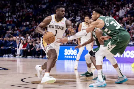 Mar 28, 2024; New Orleans, Louisiana, USA; New Orleans Pelicans forward Zion Williamson (1) dribbles against Milwaukee Bucks forward Giannis Antetokounmpo (34) during the second half at Smoothie King Center. Mandatory Credit: Stephen Lew-USA TODAY Sports