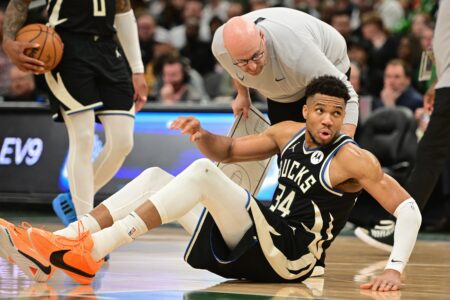 Apr 9, 2024; Milwaukee, Wisconsin, USA; Milwaukee Bucks forward Giannis Antetokounmpo (34) is helped off the floor in the third quarter and left game against the Boston Celtics with an injury at Fiserv Forum. Mandatory Credit: Benny Sieu-USA TODAY Sports