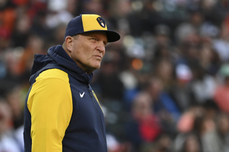 Apr 13, 2024; Baltimore, Maryland, USA; Milwaukee Brewers manager Pat Murphy (21) walks on they field during an eighth inning pitching change against the Baltimore Orioles at Oriole Park at Camden Yards. Mandatory Credit: Tommy Gilligan-USA TODAY Sports