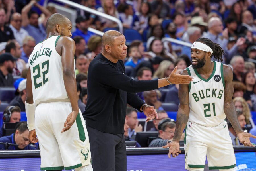 Apr 14, 2024; Orlando, Florida, USA; Milwaukee Bucks head coach Doc Rivers talks with Milwaukee Bucks guard Patrick Beverley (21) and forward Khris Middleton (22) during the second quarter against the Orlando Magic at KIA Center. Mandatory Credit: Mike Watters-USA TODAY Sports