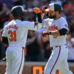 Apr 14, 2024; Baltimore, Maryland, USA; Baltimore Orioles outfielder Colton Cowser (17) celebrates with outfielder Cedric Mullins (31) after hitting a home run during the eighth inning against the Milwaukee Brewers at Oriole Park at Camden Yards. Mandatory Credit: Reggie Hildred-USA TODAY Sports