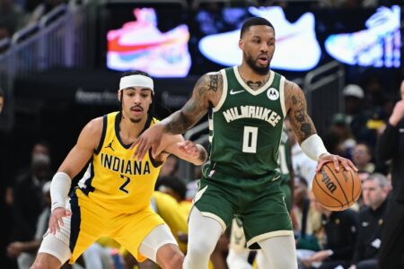 Apr 21, 2024; Milwaukee, Wisconsin, USA; Milwaukee Bucks guard Damian Lillard (0) drives for the basket against Indiana Pacers guard Andrew Nembhard (2) in the in the second quarter during game one of the first round for the 2024 NBA playoffs at Fiserv Forum. Mandatory Credit: Benny Sieu-USA TODAY Sports