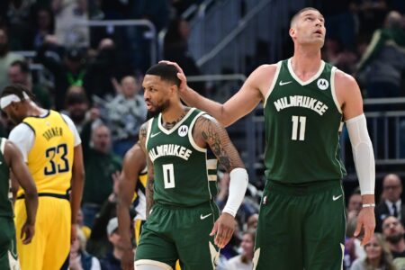 Apr 21, 2024; Milwaukee, Wisconsin, USA; Milwaukee Bucks guard Damian Lillard (0) reacts with center Brook Lopez (11) after scoring a basket in the in the second quarter against the Indiana Pacers during game one of the first round for the 2024 NBA playoffs at Fiserv Forum. Mandatory Credit: Benny Sieu-USA TODAY Sports