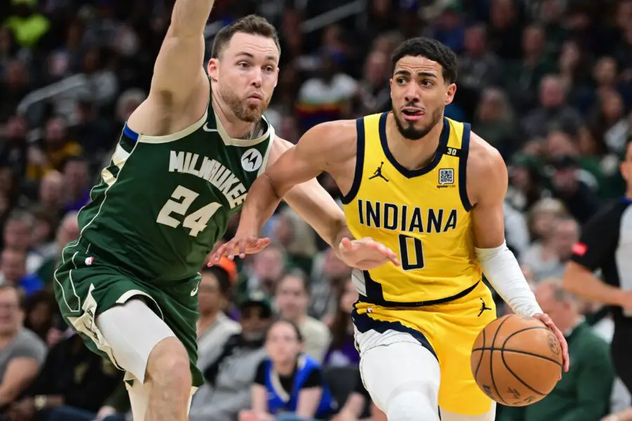 Apr 21, 2024; Milwaukee, Wisconsin, USA; Indiana Pacers guard Tyrese Haliburton (0) drives past Milwaukee Bucks guard Pat Connaughton (24) in the in the fourth quarter during game one of the first round for the 2024 NBA playoffs at Fiserv Forum. Mandatory Credit: Benny Sieu-USA TODAY Sports