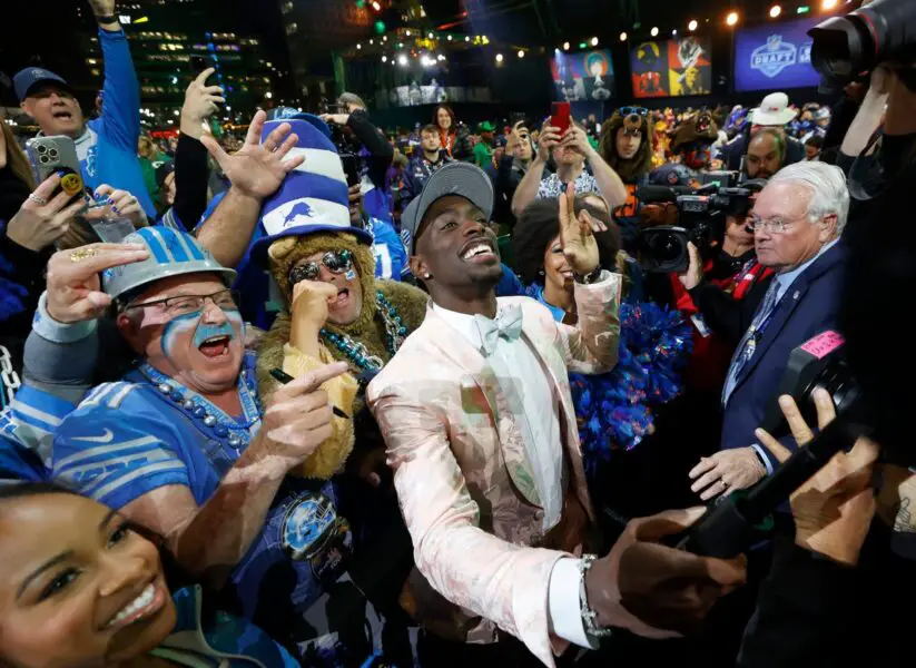 Terrion Arnold, a cornerback from the University of Alabama, celebrates with Detroit Lions fans after he was picked in the first round of the 2024 NFL draft at the NFL draft theater in Detroit on Thursday, April 25, 2024. © Eric Seals / USA TODAY NETWORK (Green Bay Packers)