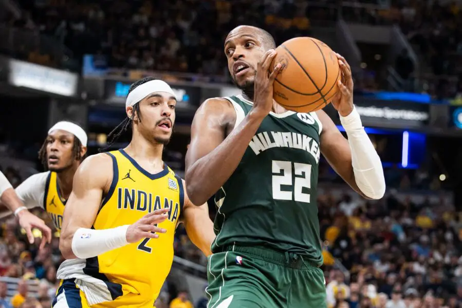 Apr 28, 2024; Indianapolis, Indiana, USA; Milwaukee Bucks forward Khris Middleton (22) holds the ball while Indiana Pacers guard Andrew Nembhard (2) defends during game four of the first round for the 2024 NBA playoffs at Gainbridge Fieldhouse. Mandatory Credit: Trevor Ruszkowski-USA TODAY Sports