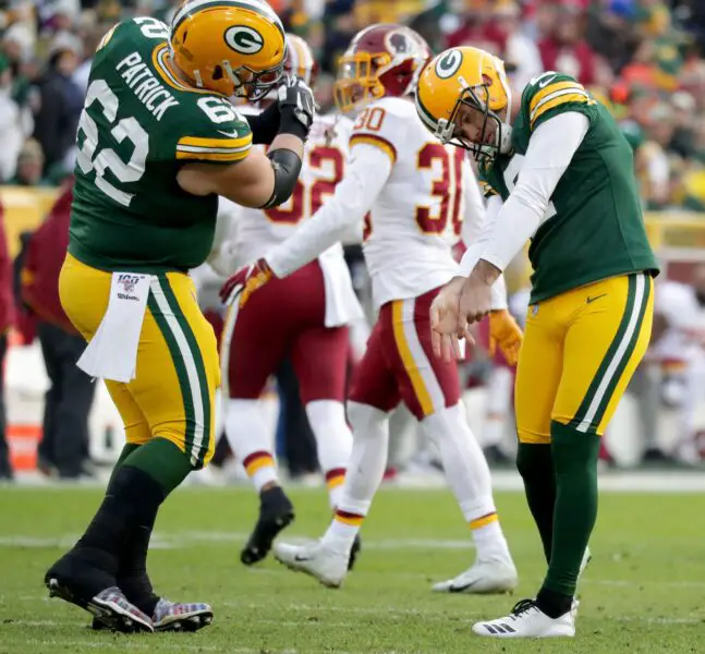 Green Bay Packers kicker Mason Crosby (2) does a mock golf swine with Green Bay Packers offensive guard Lucas Patrick (62) after hitting a 32 Yd Field Goal during the 2nd half of the Green Bay Packers 20-15 win over the Washington Redskins at Lambeau Field in Green Bay on Sunday, Dec. 8, 2019. Photo by Mike De Sisti/Milwaukee Journal Sentinel