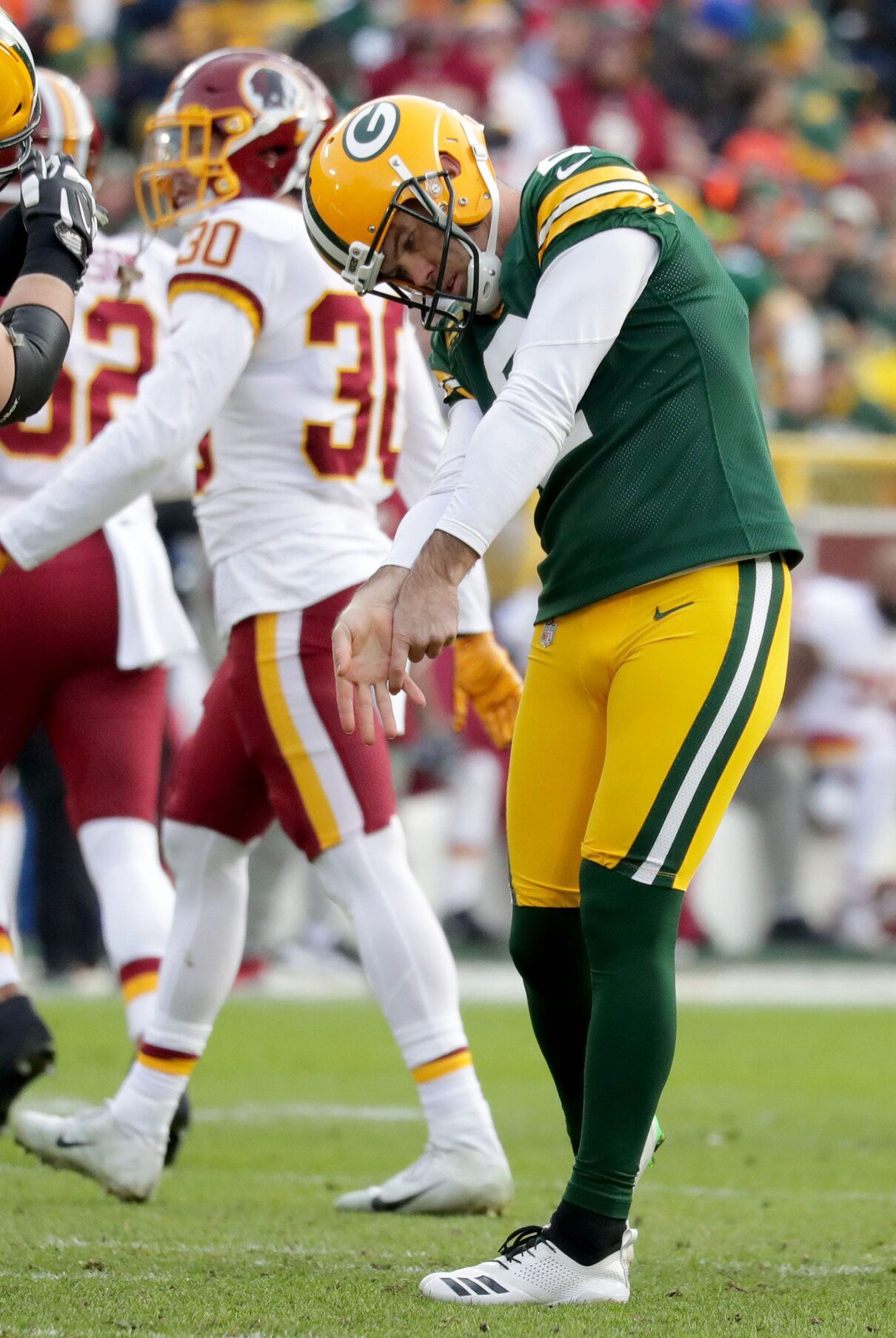 Green Bay Packers kicker Mason Crosby (2) does a mock golf swine with Green Bay Packers offensive guard Lucas Patrick (62) after hitting a 32 Yd Field Goal during the 2nd half of the Green Bay Packers 20-15 win over the Washington Redskins at Lambeau Field in Green Bay on Sunday, Dec. 8, 2019. Photo by Mike De Sisti/Milwaukee Journal Sentinel