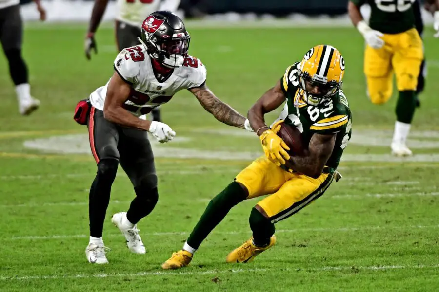 Jan 24, 2021; Green Bay, Wisconsin, USA; Green Bay Packers wide receiver Marquez Valdes-Scantling (83) runs the ball against Tampa Bay Buccaneers cornerback Sean Murphy-Bunting (23) during the fourth quarter in the NFC Championship Game at Lambeau Field . Mandatory Credit: Benny Sieu-USA TODAY Sports