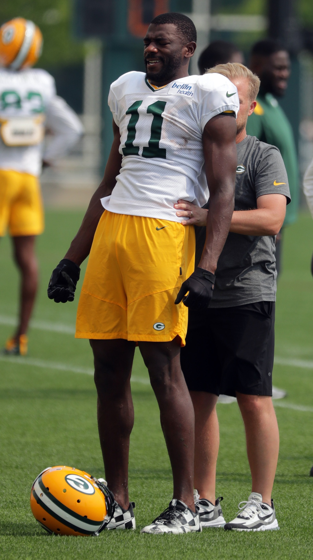 Aug 11, 2021; Green Bay, WI, USA; Green Bay Packers wide receiver Devin Funchess (11) works with a member of the training staff during training camp Wednesday, August 11, 2021 in Green Bay, Wis. Mandatory Credit: Mark Hoffman-USA TODAY NETWORK