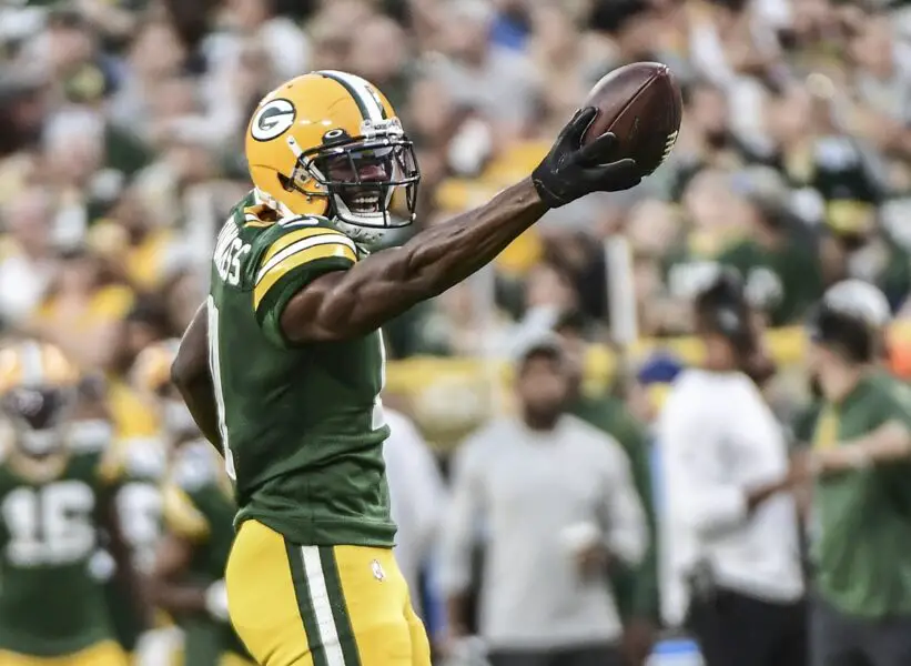 Aug 14, 2021; Green Bay, Wisconsin, USA; Green Bay Packers wide receiver Devin Funchess (11) reacts after picking up a first down against the Houston Texans in the first quarter at Lambeau Field. Mandatory Credit: Benny Sieu-USA TODAY Sports