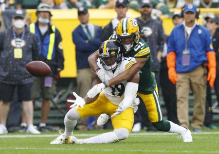 Oct 3, 2021; Green Bay, Wisconsin, USA; Green Bay Packers cornerback Eric Stokes (21) defends the pass intended for Pittsburgh Steelers wide receiver JuJu Smith-Schuster (19) during the first quarter at Lambeau Field. Mandatory Credit: Jeff Hanisch-USA TODAY Sports