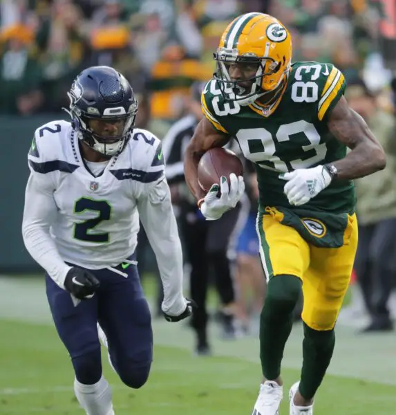 Green Bay Packers wide receiver Marquez Valdes-Scantling (83) picks up 43 yards in a reception while being pursued by Seattle Seahawks cornerback D.J. Reed (2) during the first quarter of their game Sunday, November 14, 2021 at Lambeau Field in Green Bay, Wis. The Green Bay Packers beat the Seattle Seahawks 17-0. © MARK HOFFMAN/MILWAUKEE JOURNAL SENTINEL / USA TODAY NETWORK