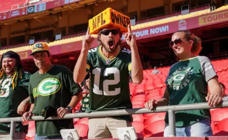 Aug 25, 2022; Kansas City, Missouri, USA; A few Green Bay Packers fans show their support before a preseason game against the Kansas City Chiefs at GEHA Field at Arrowhead Stadium. Mandatory Credit: Denny Medley-USA TODAY Sports