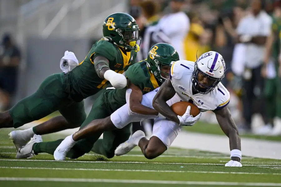 Sep 3, 2022; Waco, Texas, USA; Albany Great Danes wide receiver Julian Hicks (1) is tackled by Baylor Bears safety Al Walcott (13) during the second quarter at McLane Stadium. Mandatory Credit: Jerome Miron-USA TODAY Sports. (Green Bay Packers)