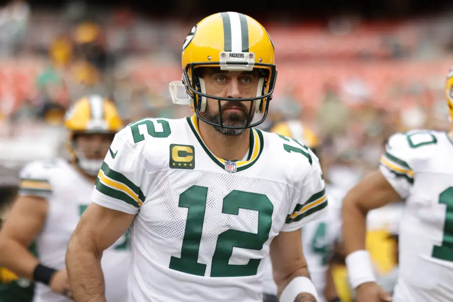 Oct 23, 2022; Landover, Maryland, USA; Green Bay Packers quarterback Aaron Rodgers (12) runs onto the field for warmup prior to the game against the Washington Commanders at FedExField. Mandatory Credit: Geoff Burke-USA TODAY Sports