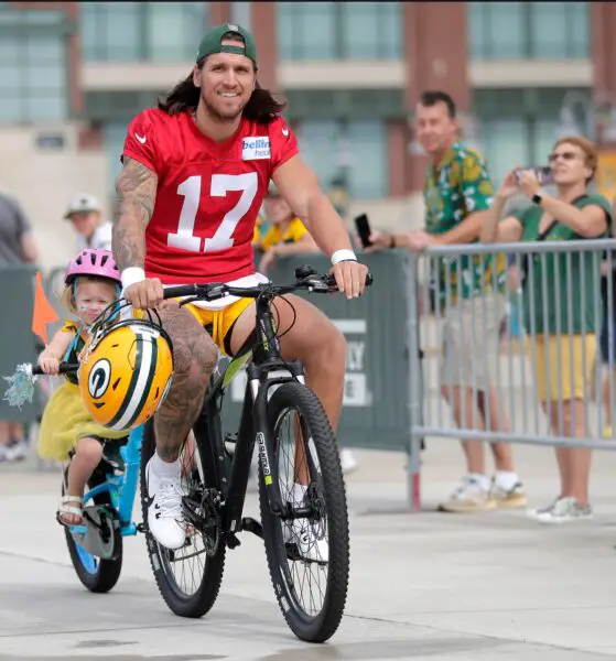 Green Bay Packers Alex McGough (17) rides a fan’s bike to the first day of training camp on Wednesday, July 26, 2023 at Ray Nitschke Field in Green Bay, Wis.© Wm. Glasheen USA TODAY NETWORK-Wisconsin / USA TODAY NETWORK