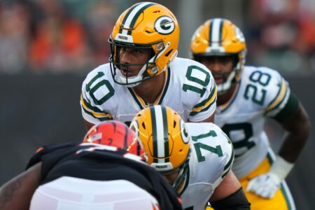 Green Bay Packers quarterback Jordan Love (10) prepares for a snap in the first quarter during a Week 1 NFL preseason game between the Green Bay Packers and the Cincinnati Bengals,Friday, Aug. 11, 2023, at Paycor Stadium in Cincinnati. © Kareem Elgazzar/The Enquirer / USA TODAY NETWORK