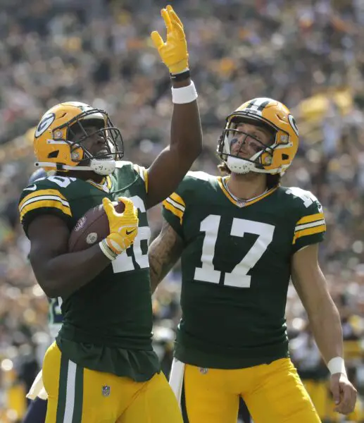 Aug 26, 2023; Green Bay, WI, USA; Green Bay Packers running back Nate McCrary (46) and quarterback Alex McGough (17) celebrate after a touchdown against the Seattle Seahawks during the fourth quarter at Lambeau Field. Green Bay won 19-15. Mandatory Credit: Wm. Glasheen-USA TODAY Sports