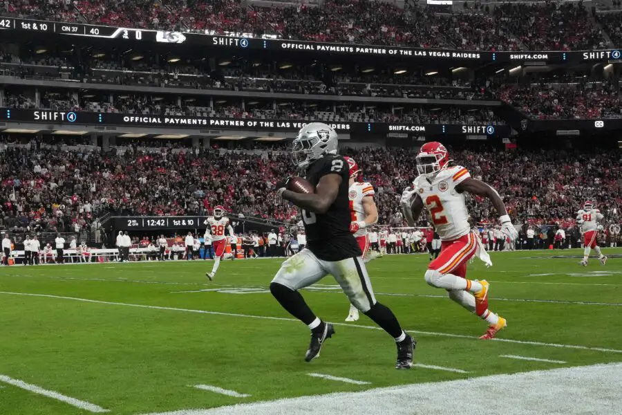 Nov 26, 2023; Paradise, Nevada, USA; Las Vegas Raiders running back Josh Jacobs (8) is pursued by Kansas City Chiefs cornerback Joshua Williams (2) on a 63-yard touchdown run in the first half at Allegiant Stadium. Mandatory Credit: Kirby Lee-USA TODAY Sports (Green Bay Packers)