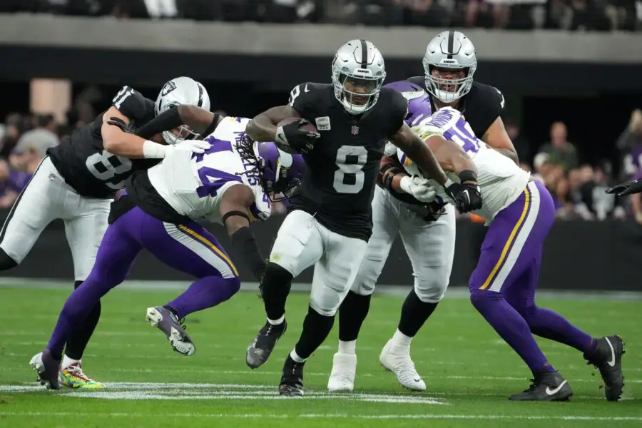 Dec 10, 2023; Paradise, Nevada, USA; Las Vegas Raiders running back Josh Jacobs (8) carries the ball against the Minnesota Vikings in the first half at Allegiant Stadium. Mandatory Credit: Kirby Lee-USA TODAY Sports Green Bay Packers