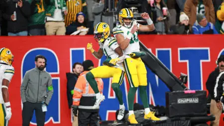 Dec 11, 2023; East Rutherford, New Jersey, USA; Green Bay Packers wide receiver Jayden Reed (11) and Green Bay Packers quarterback Jordan Love (10) celebrate after a touchdown during the second quarter against the New York Giants at MetLife Stadium. Mandatory Credit: Vincent Carchietta-USA TODAY Sports