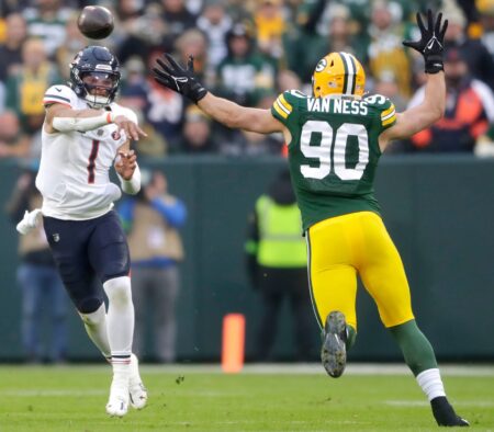 Chicago Bears quarterback Justin Fields (1) throwns under pressure from Green Bay Packers linebacker Lukas Van Ness (90) during their football game Sunday, January 7, 2024, at Lambeau Field in