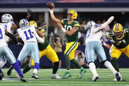 Jan 14, 2024; Arlington, Texas, USA; Green Bay Packers quarterback Jordan Love (10) drops back to pass against the Dallas Cowboys in the first half of the 2024 NFC wild card game at AT&T Stadium. Mandatory Credit: Kevin Jairaj-USA TODAY Sports